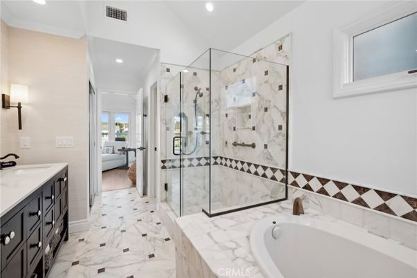 Bathroom, Dual Sink Vanities, Glass Shower, Interior, Marble, Marble Walls, Recessed Lighting