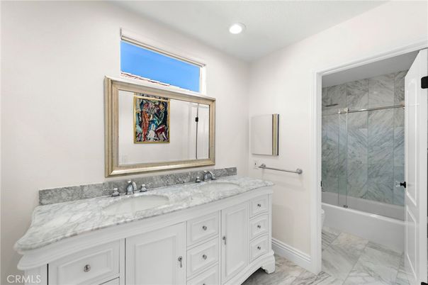 Bathroom, Dual Sink Vanities, Glass Shower, Interior, Marble, Marble Walls, Recessed Lighting