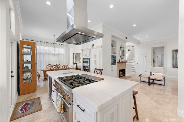 Chandelier, Dining room, Fireplace, Interior, Kitchen, Pendant Lights, Recessed Lighting, Stainless Steel Appliances