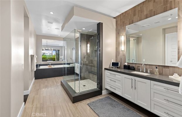 Bathroom, Dual Sink Vanities, Free Standing Baths, Glass Shower, Interior, Pendant Lights, Recessed Lighting, Wood Texture Flooring