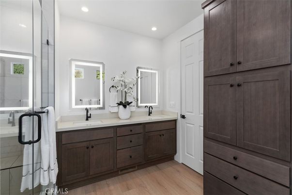 Bathroom, Dual Sink Vanities, Glass Shower, Interior, Recessed Lighting, Wood Texture Flooring