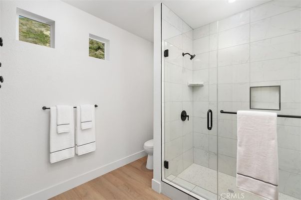Bathroom, Glass Shower, Interior, Marble Walls, Wood Texture Flooring