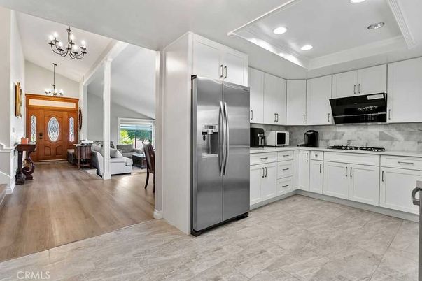Chandelier, Interior, Kitchen, Pendant Lights, Recessed Lighting, Stainless Steel Appliances, Wood Texture Flooring