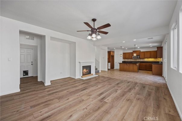 Empty room, Fireplace, Interior, Kitchen, Pendant Lights, Recessed Lighting, Wood Texture Flooring