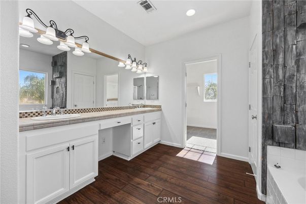 Bathroom, Dual Sink Vanities, Interior, Recessed Lighting, Tile Countertops, Wood Texture Flooring