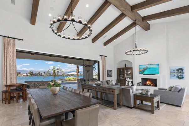 Chandelier, Dining room, Fireplace, Interior, Living room, Pendant Lights, Recessed Lighting, Water, Wooden Beams