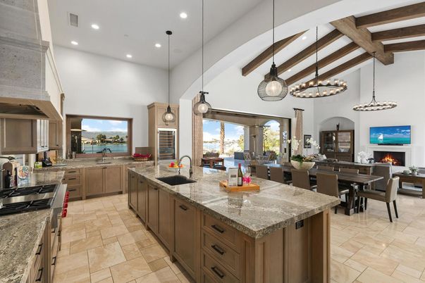 Dining room, Fireplace, Interior, Kitchen, Living room, Pendant Lights, Recessed Lighting, Stainless Steel Appliances, Water, Wooden Beams