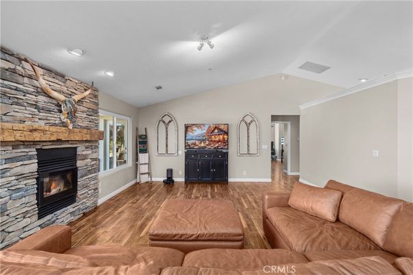 Fireplace, Interior, Living room, Recessed Lighting, Stone Walls, Wood Texture Flooring
