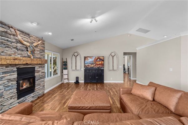 Fireplace, Interior, Living room, Recessed Lighting, Stone Walls, Wood Texture Flooring