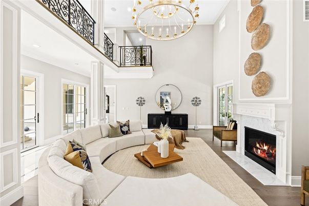 Chandelier, Fireplace, Interior, Living room, Recessed Lighting, Wood Texture Flooring