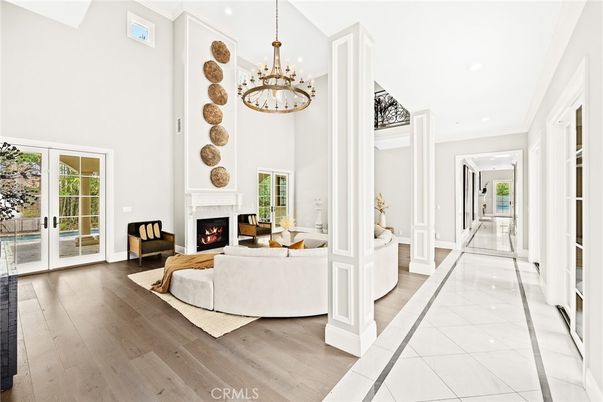 Chandelier, Fireplace, Interior, Living room, Recessed Lighting, Wood Texture Flooring