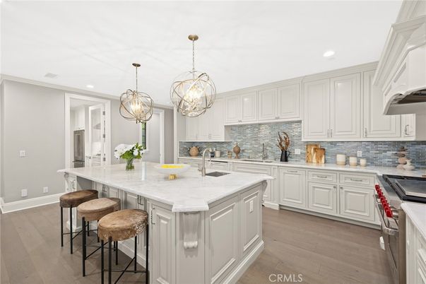 Chandelier, Interior, Kitchen, Pendant Lights, Recessed Lighting, Stainless Steel Appliances, Wood Texture Flooring