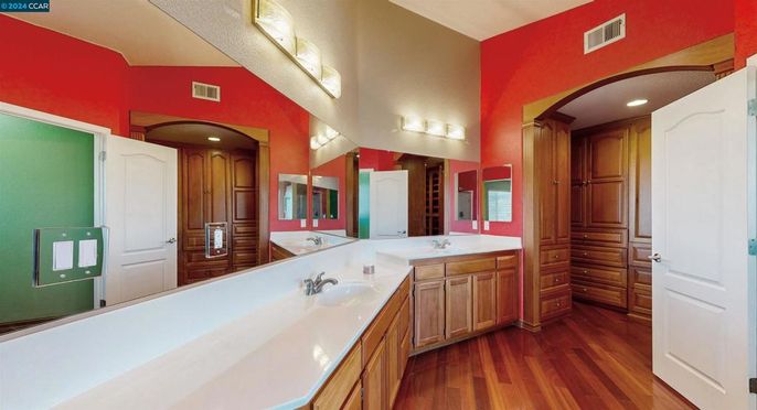 Bathroom, Dual Sink Vanities, Interior, Recessed Lighting, Wood Texture Flooring
