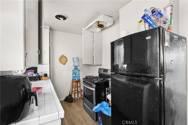 Interior, Kitchen, Tile Countertops, Wood Texture Flooring