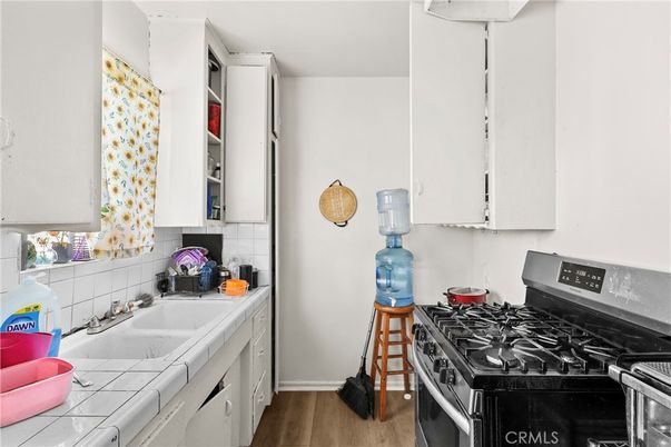 Interior, Kitchen, Tile Countertops, Wood Texture Flooring