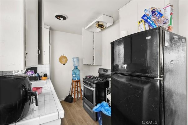 Interior, Kitchen, Tile Countertops, Wood Texture Flooring