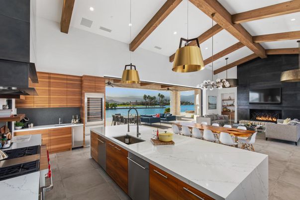 Dining room, Fireplace, Interior, Kitchen, Living room, Pendant Lights, Recessed Lighting, Stainless Steel Appliances, Water, Wooden Beams