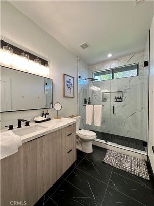 Bathroom, Dual Sink Vanities, Glass Shower, Interior, Marble, Marble Walls, Recessed Lighting