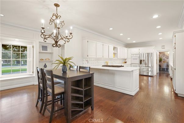 Chandelier, Dining room, Interior, Kitchen, Recessed Lighting, Stainless Steel Appliances, Wood Texture Flooring