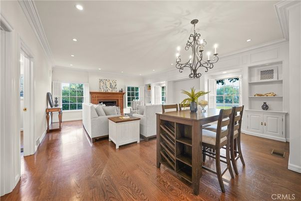 Chandelier, Dining room, Fireplace, Interior, Living room, Recessed Lighting, Wood Texture Flooring