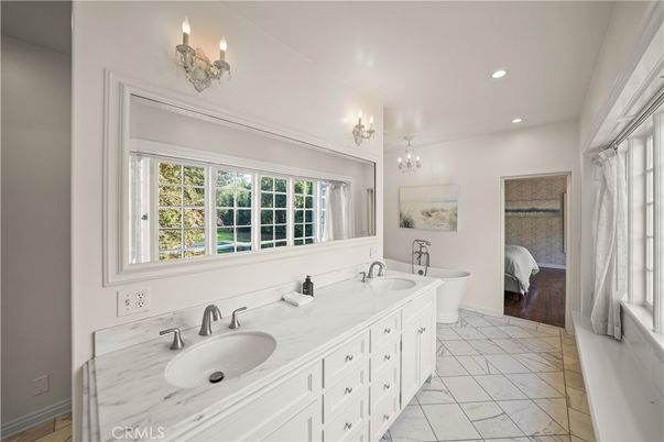 Bathroom, Bedroom, Chandelier, Dual Sink Vanities, Interior, Marble, Recessed Lighting, Wood Texture Flooring
