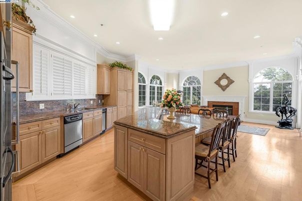 Fireplace, Interior, Kitchen, Recessed Lighting, Stainless Steel Appliances, Wood Texture Flooring