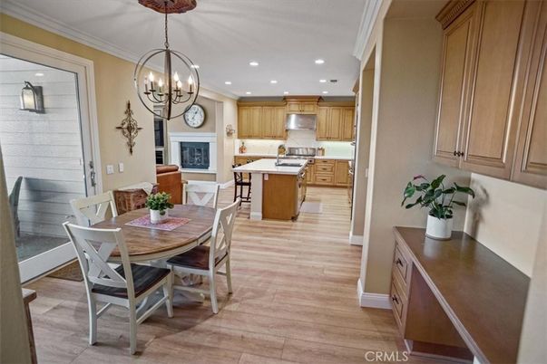 Chandelier, Dining room, Fireplace, Interior, Kitchen, Pendant Lights, Recessed Lighting, Wood Texture Flooring
