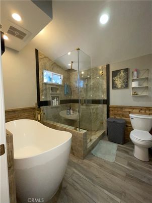 Bathroom, Free Standing Baths, Glass Shower, Interior, Recessed Lighting, Wood Texture Flooring