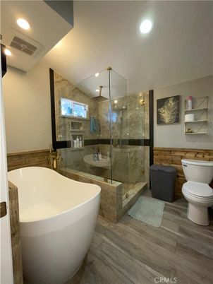 Bathroom, Free Standing Baths, Glass Shower, Interior, Recessed Lighting, Wood Texture Flooring