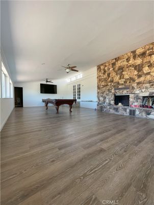 Billiard Table, Fireplace, Game Room, Interior, Stone Walls, Wood Texture Flooring