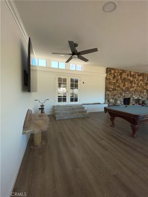 Billiard Table, Fireplace, Game Room, Interior, Stone Walls, Wood Texture Flooring