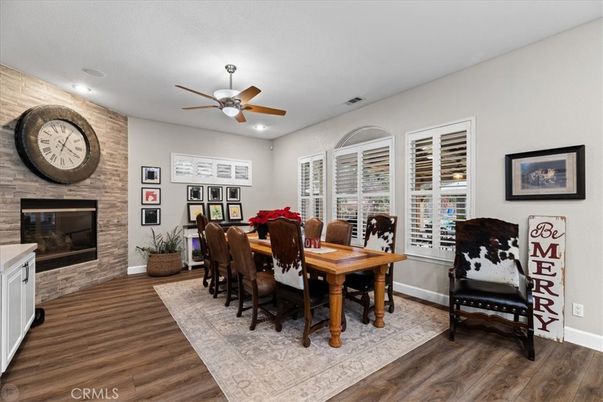 Dining room, Fireplace, Interior, Recessed Lighting, Stone Walls, Wood Texture Flooring