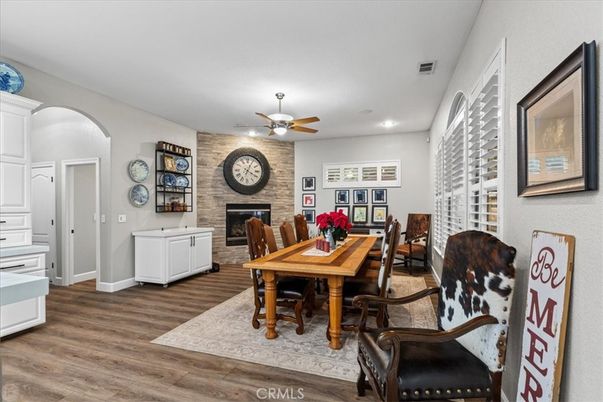 Dining room, Fireplace, Interior, Recessed Lighting, Stone Walls, Wood Texture Flooring