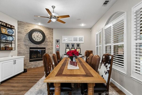 Dining room, Fireplace, Interior, Recessed Lighting, Stone Walls, Wood Texture Flooring
