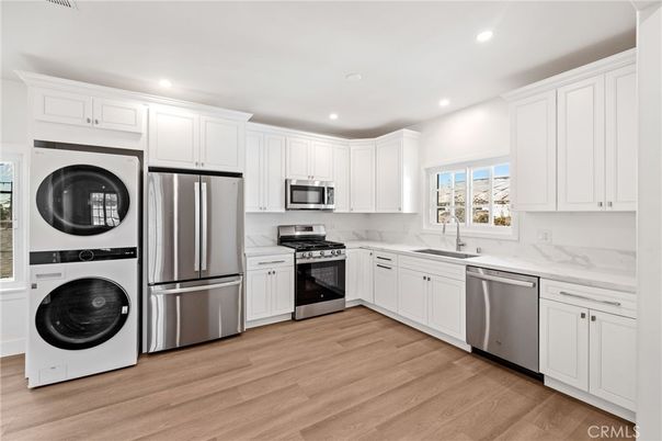 Interior, Kitchen, Recessed Lighting, Stainless Steel Appliances, Washer, Wood Texture Flooring