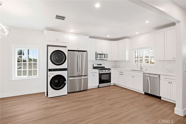 Interior, Kitchen, Recessed Lighting, Stainless Steel Appliances, Washer, Wood Texture Flooring