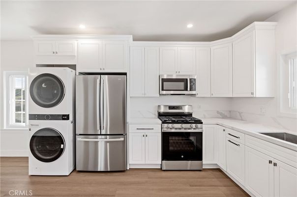Interior, Kitchen, Recessed Lighting, Stainless Steel Appliances, Washer, Wood Texture Flooring