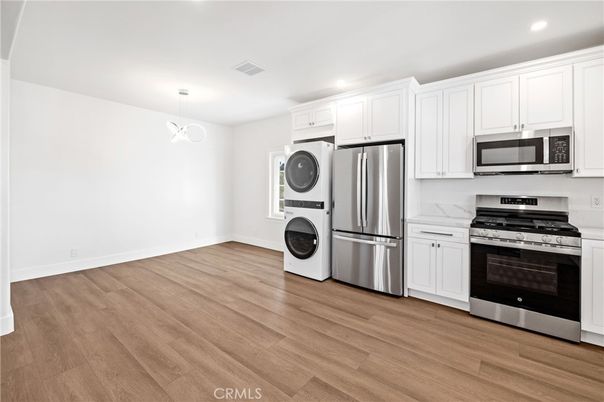 Interior, Kitchen, Pendant Lights, Recessed Lighting, Stainless Steel Appliances, Washer, Wood Texture Flooring
