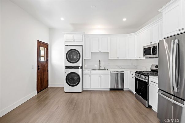 Interior, Kitchen, Recessed Lighting, Stainless Steel Appliances, Washer, Wood Texture Flooring