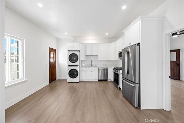 Interior, Kitchen, Recessed Lighting, Stainless Steel Appliances, Washer, Wood Texture Flooring
