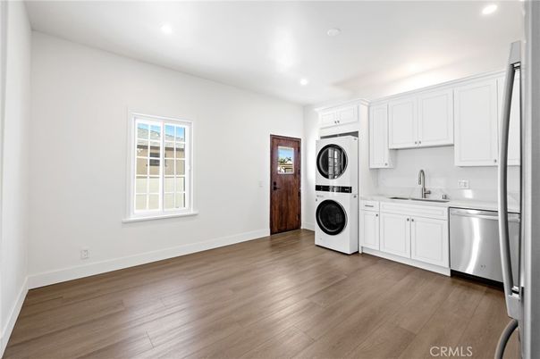 Interior, Kitchen, Recessed Lighting, Washer, Wood Texture Flooring