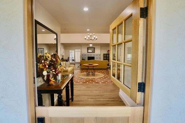 Chandelier, Fireplace, Interior, Living room, Recessed Lighting, Wood Texture Flooring