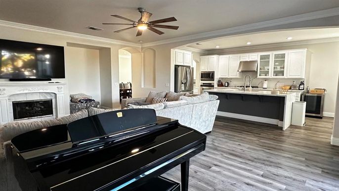 Fireplace, Interior, Kitchen, Living room, Piano, Recessed Lighting, Stainless Steel Appliances, Wood Texture Flooring