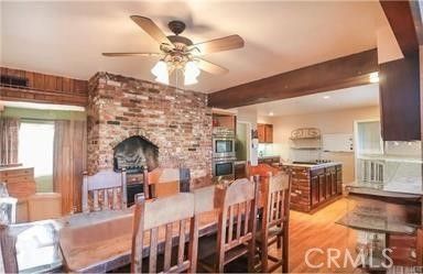 Dining room, Fireplace, Interior, Kitchen, Recessed Lighting, Stone Walls, Wooden Beams, Wood Texture Flooring