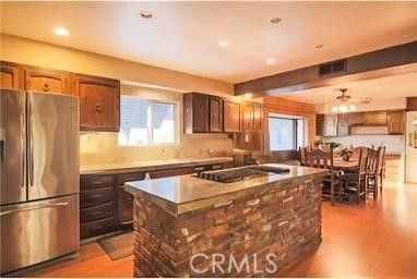 Dining room, Interior, Kitchen, Pendant Lights, Recessed Lighting, Stainless Steel Appliances, Wooden Beams, Wood Texture Flooring