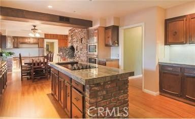 Chandelier, Dining room, Interior, Kitchen, Recessed Lighting, Stainless Steel Appliances, Wooden Beams, Wood Texture Flooring