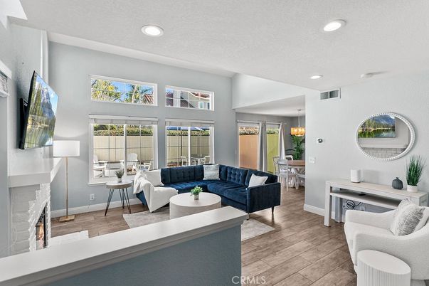 Dining room, Fireplace, Interior, Living room, Pendant Lights, Recessed Lighting, Wood Texture Flooring