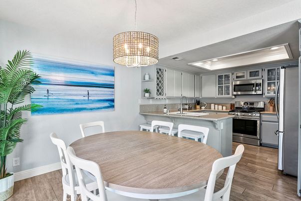 Dining room, Interior, Kitchen, Pendant Lights, Recessed Lighting, Stainless Steel Appliances, Wood Texture Flooring