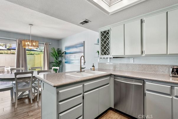 Chandelier, Dining room, Interior, Kitchen, Pendant Lights, Stainless Steel Appliances, Wood Texture Flooring