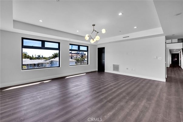 Empty room, Interior, Pendant Lights, Recessed Lighting, Stainless Steel Appliances, Wood Texture Flooring